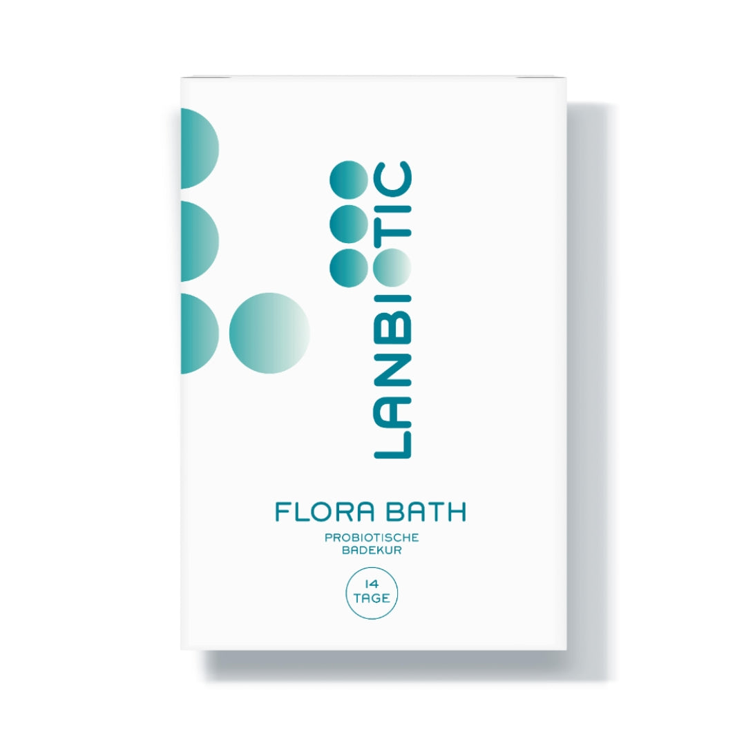 Produktfoto von Flora Bath. Eine weiße Verpackung mit türkiser Schrift